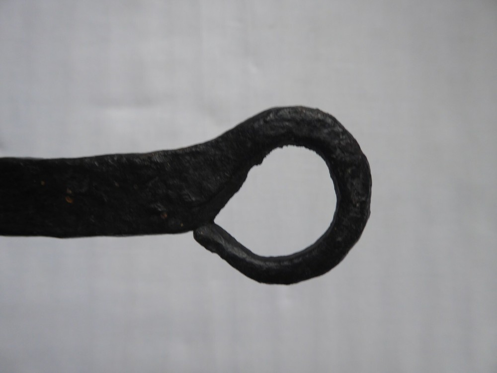 A 18TH CENTURY PRMATIVE FORGED IRON TRIVET