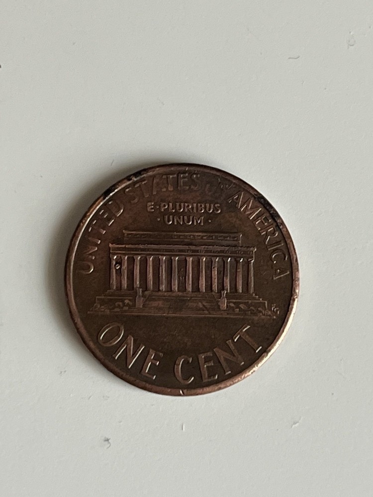 1993 d mark penny with die error between colums