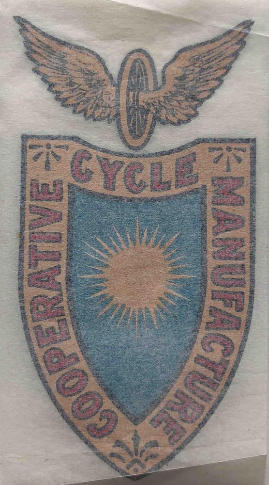 CO-OP shield with winged wheel