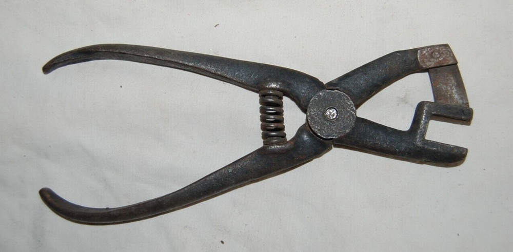 Unusal Antique Spring Loaded Iron Crimper ?