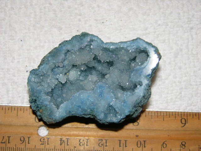 Geode cut & polished half with colored crystal center 2.5 inch E58