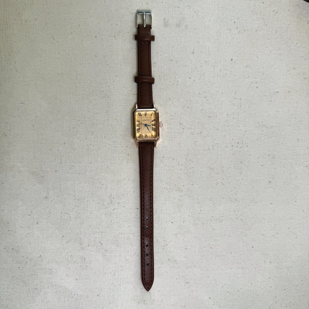 2000s vintage style rectangular gold luxury watch with leather band