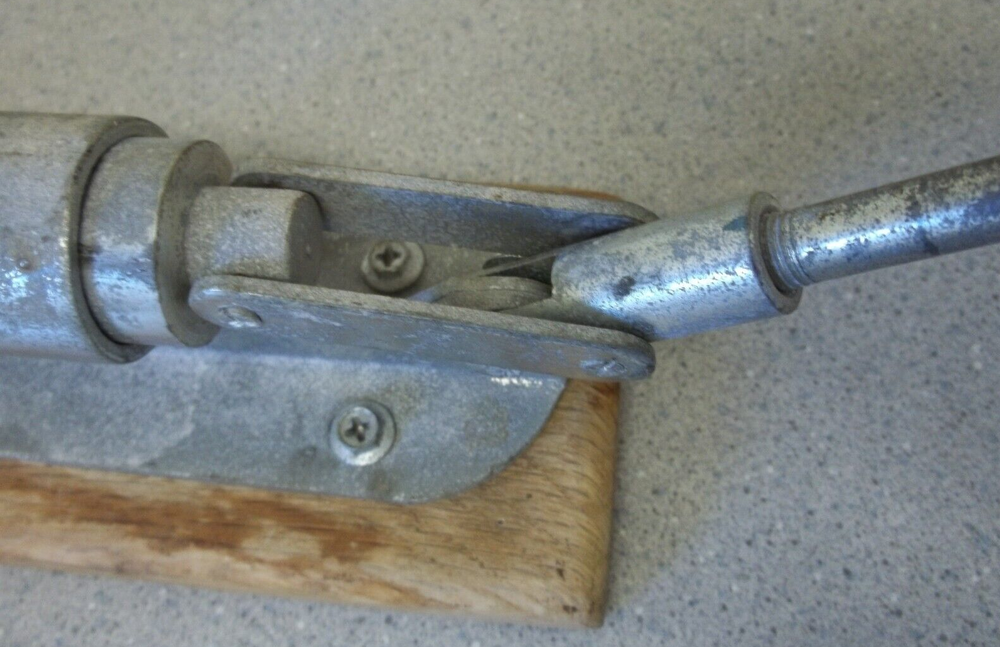 Nutcracker with red handle knob on wooden base Vintage adjustable nutcracker