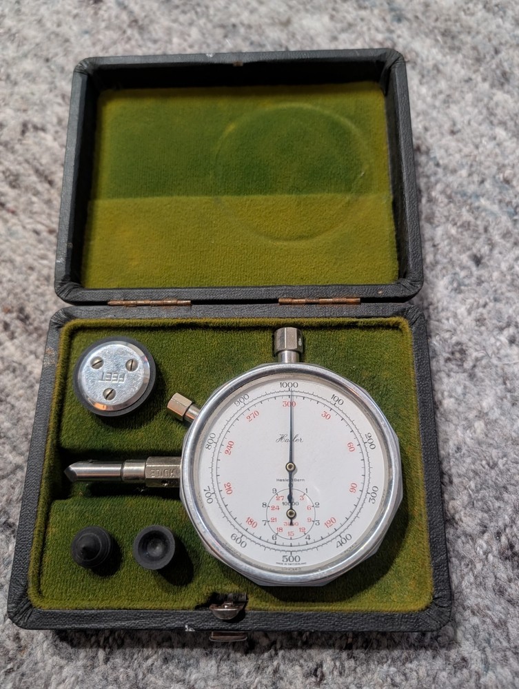 Vintage Hasler-Bern mechanical tachometer speed indicator with accessories.