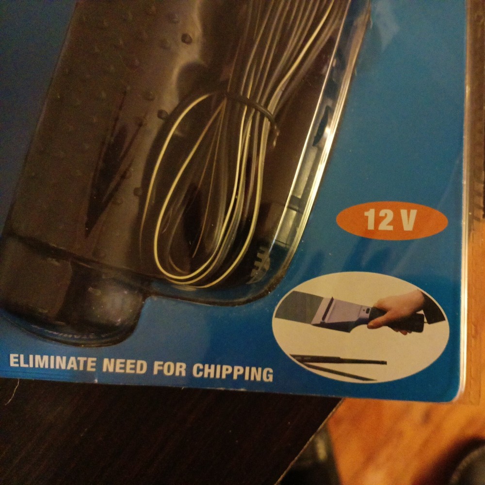 Heated Ice Scraper Rapidly Dislodges Ice Cream Windshield Nip
