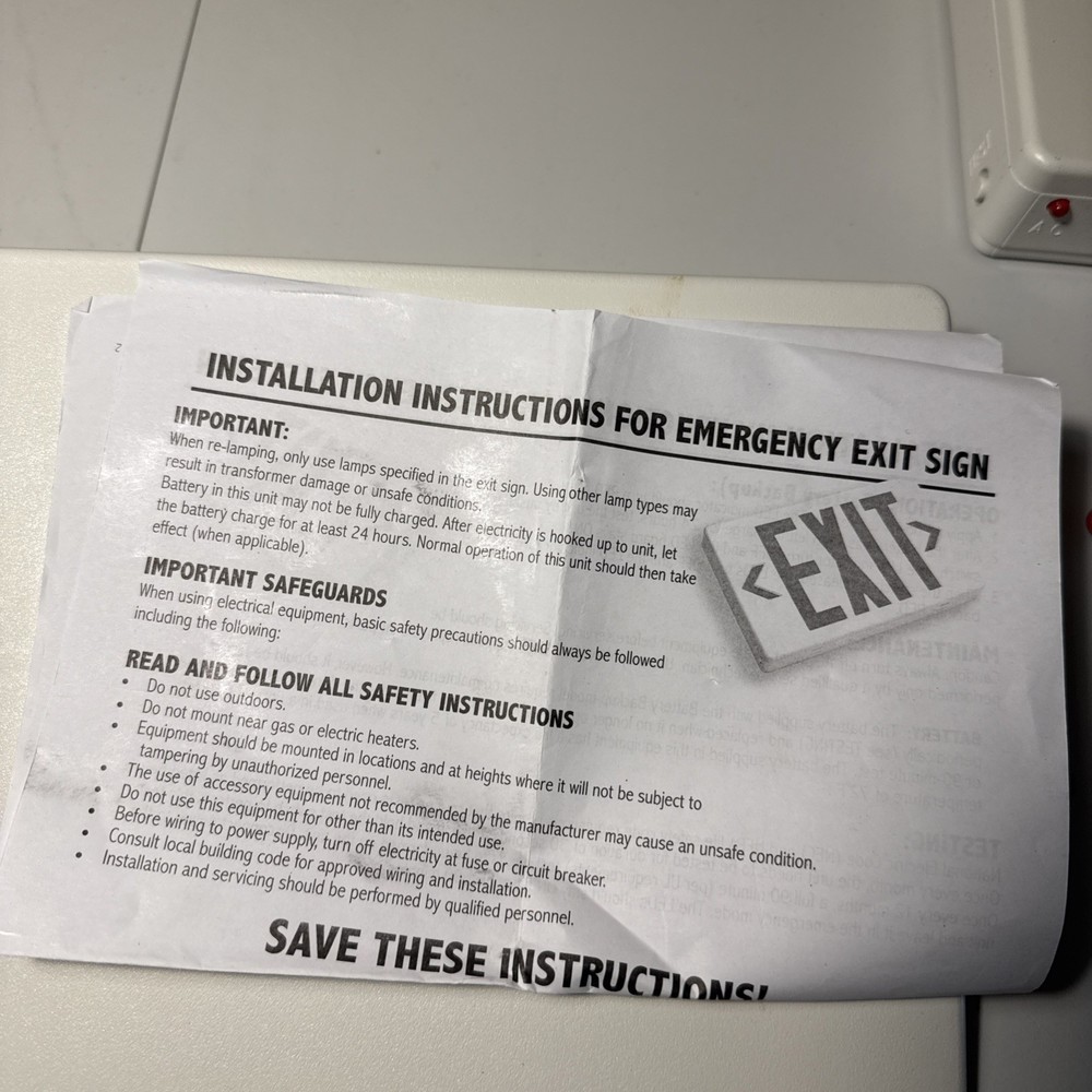 Red Light White Housing Battery Back Up Exit Sign.