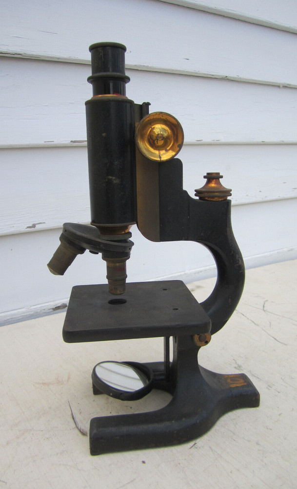 Antique microscope with brass trim