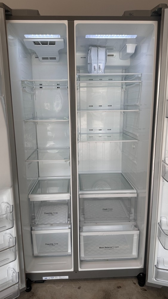 Stainless steel side by side LG refrigerator freezer