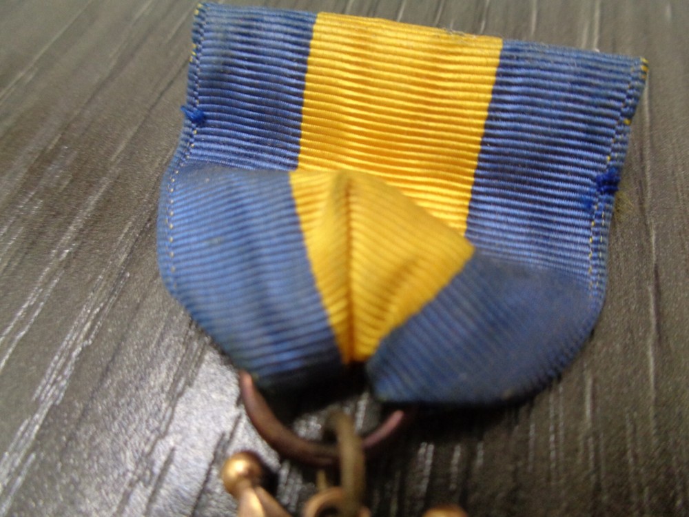 Vintage Bugle Roster Medal DISTINGUISHED