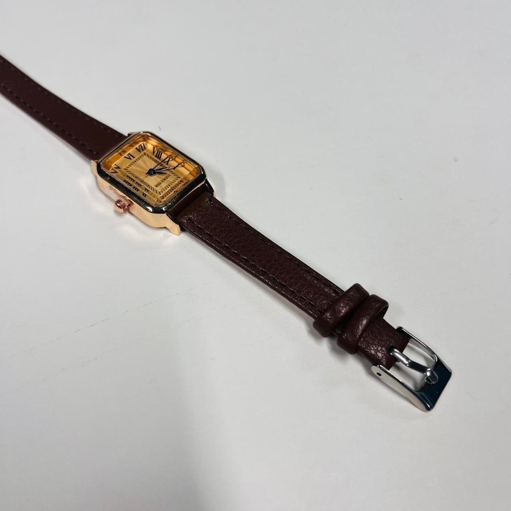 2000s vintage style rectangular gold luxury watch with leather band