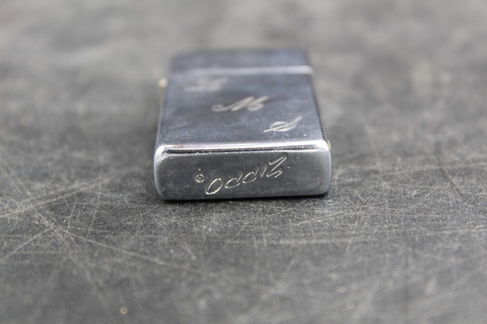 Zippo Lighter 2-1/4” X 1-1/8”.