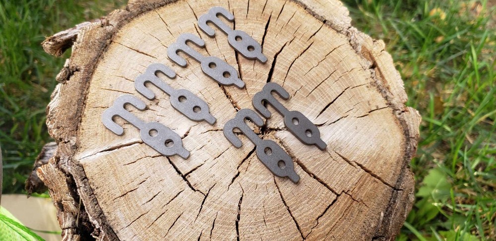 Titanium toggle button , double hook cord managment device