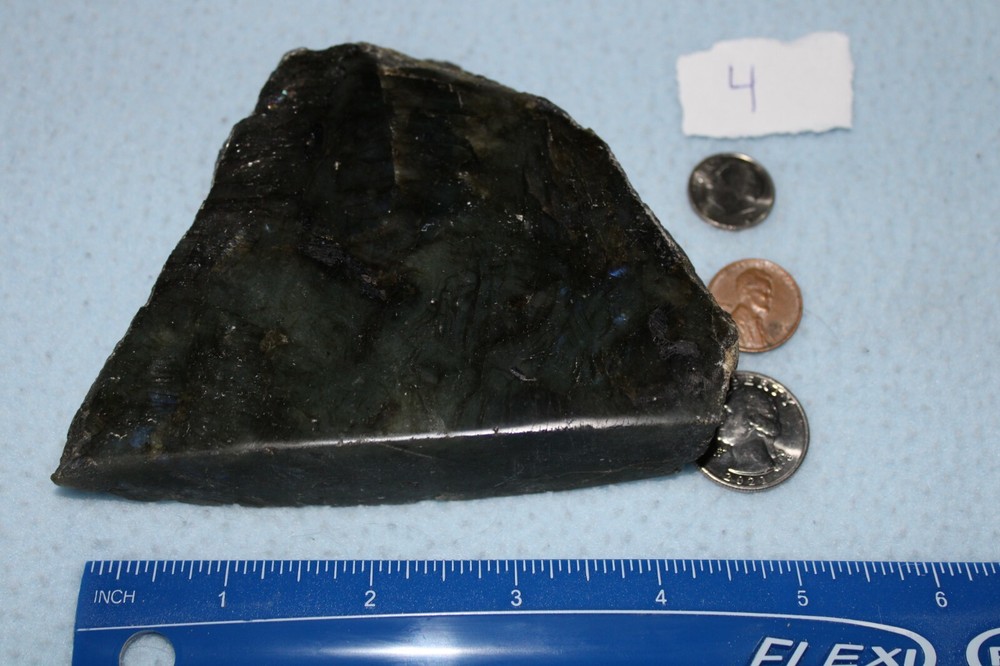 1 standing labradorite that is over 1 pound . Polished one side.