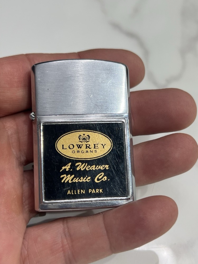 vintage “lowrey” silver matchbox holder