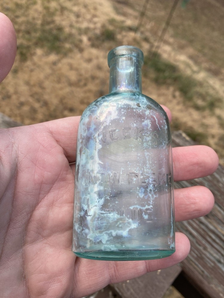 Week’s Snow Flake Blue Antique Bottle