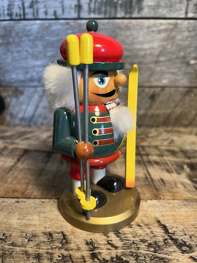 Vintage Christmas Nutcracker Holding Skies