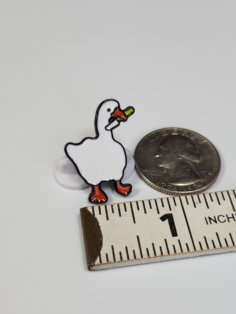 White Duck Holding a Knife Lapel Pin