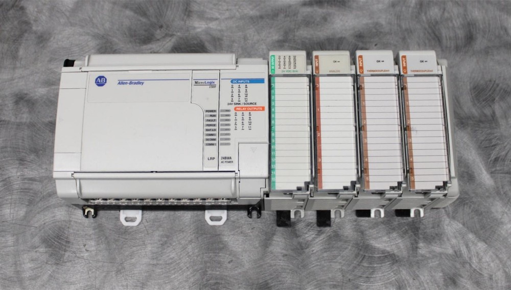 Allen-Bradley MicroLogix 1500 Programmable Controller 1764-24BWA w/ I/O Modules