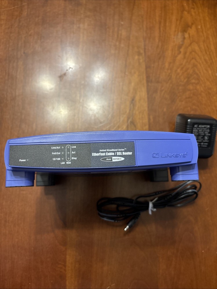 Linksys EtherFast 100 Mbps 1-Port 10/100 EtherFast Router (BEFSR11) + Adaptor