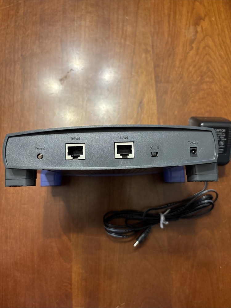 Linksys EtherFast 100 Mbps 1-Port 10/100 EtherFast Router (BEFSR11) + Adaptor