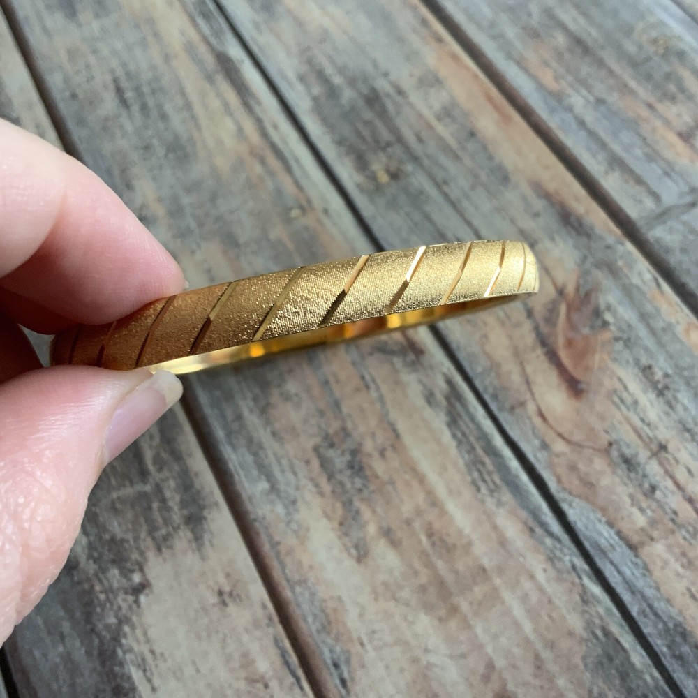 Classic MONET medium sized etched textured diamond dust stripped bangle in gold