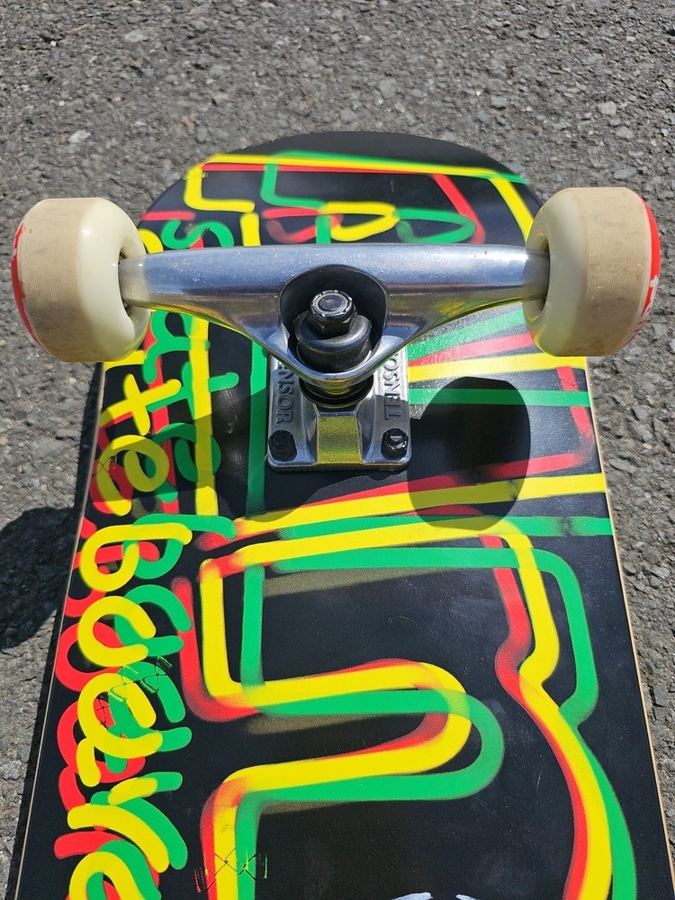 Almost Skateboards Complete Rasta Neon Logo Deck Tensor Trucks