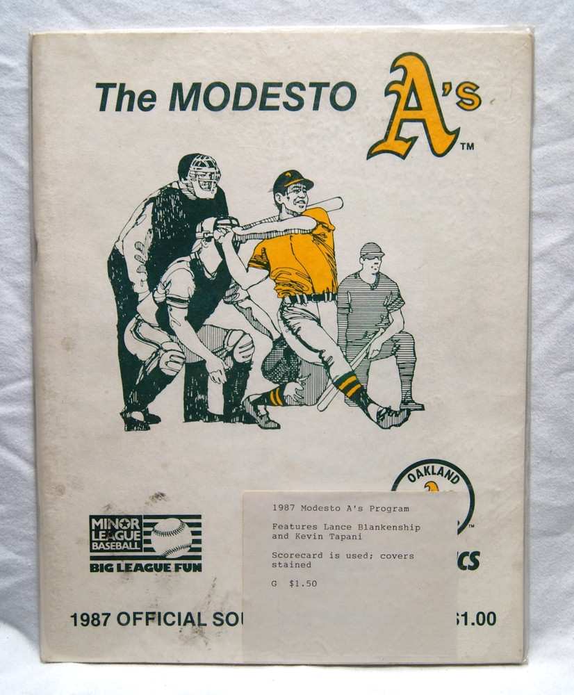1987 modesto a's official souvenir program cover is stained scorecard is used