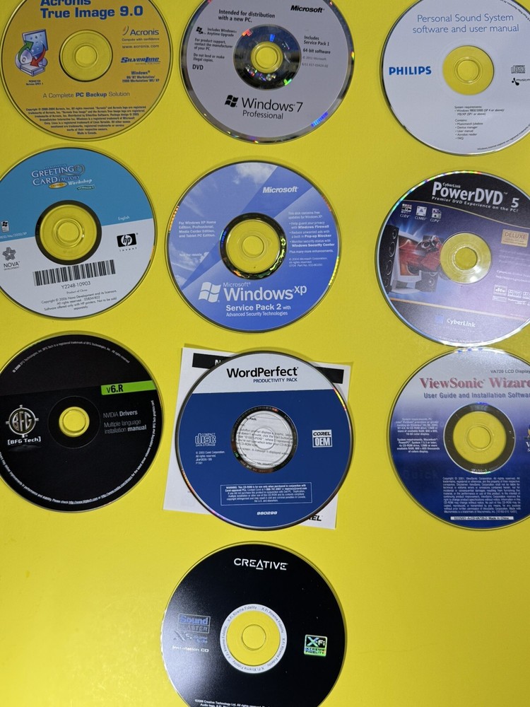 10 Vintage CD Rom Softwares Windows XP , Windows 7 , Acronis , Driver discs.