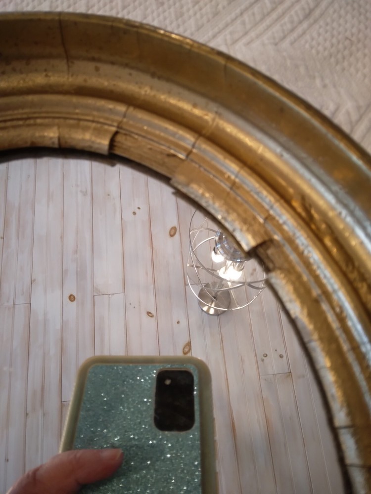 Antique Oval gilt Victorian mirror.