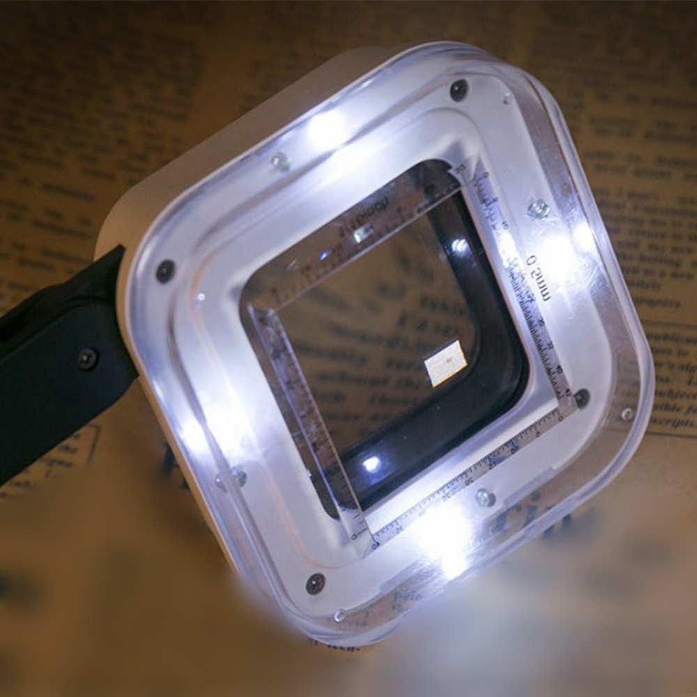 Folding handheld magnifier with four LED lights and precise detachable scale