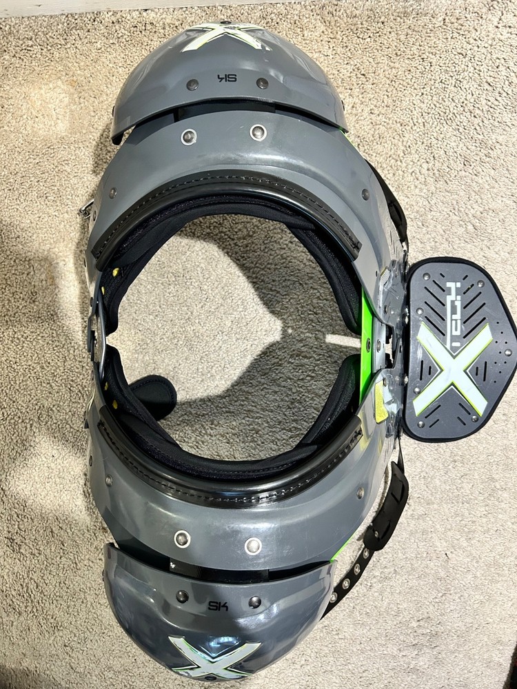 XTECH Medium shoulder pads (Football) comes with size small backplate.