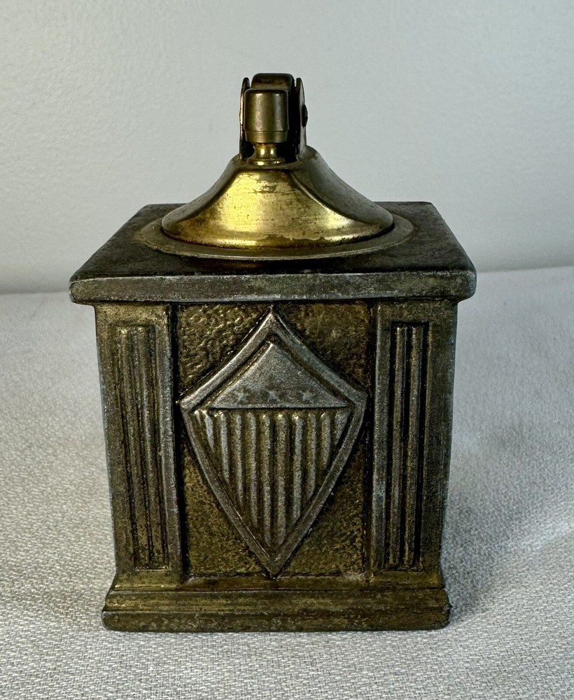 Brass Table lighter with crest/ rifle & sword motif