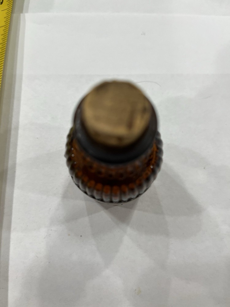 Small Amber Round Ribbed McKESSONS bottle