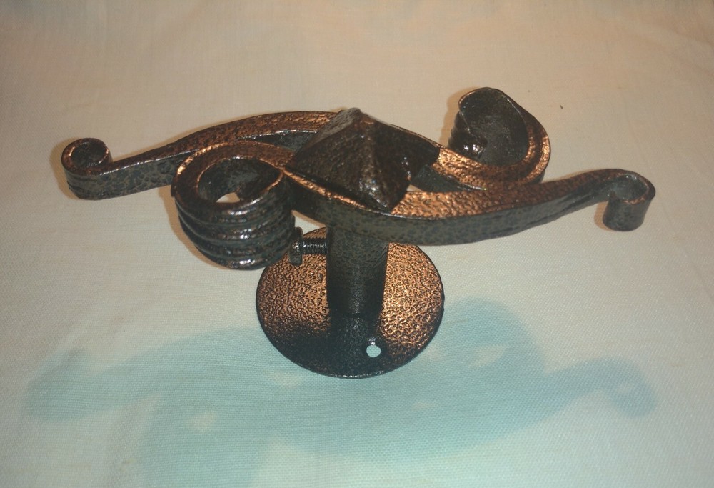 Wrought iron handle for the fireplace