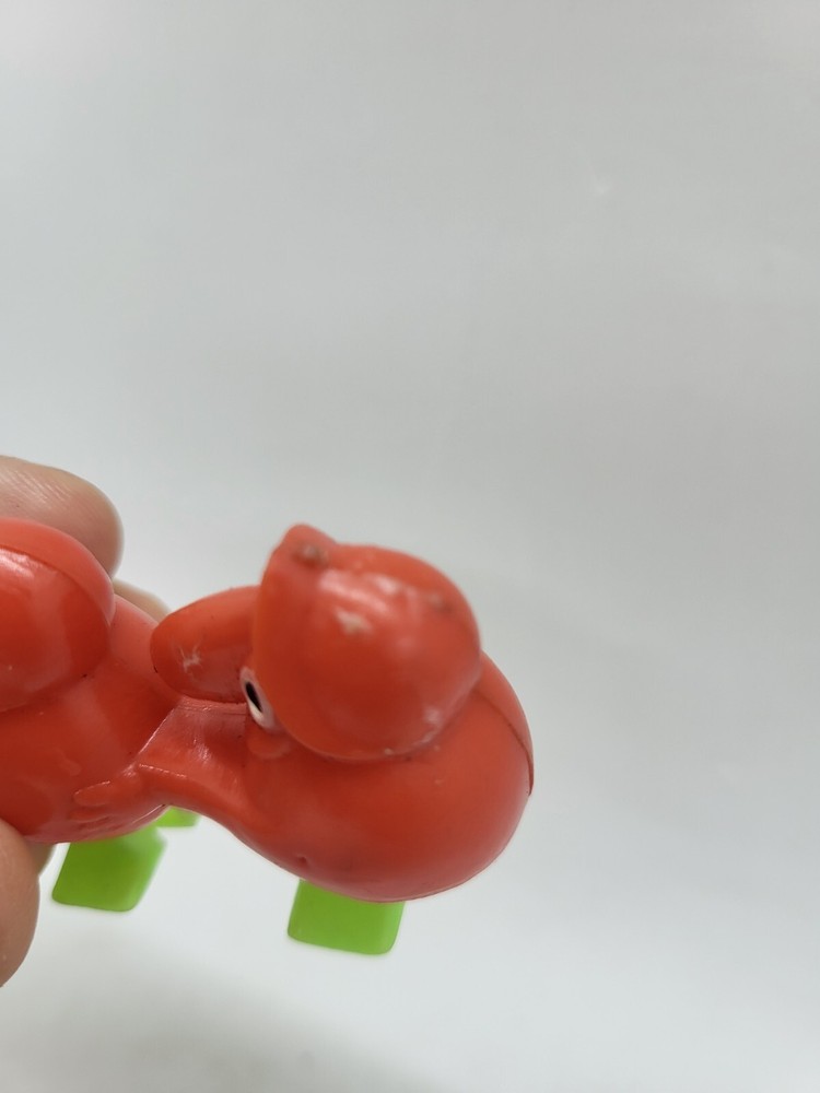 Vintage Minature Red Plastic Goon Walking