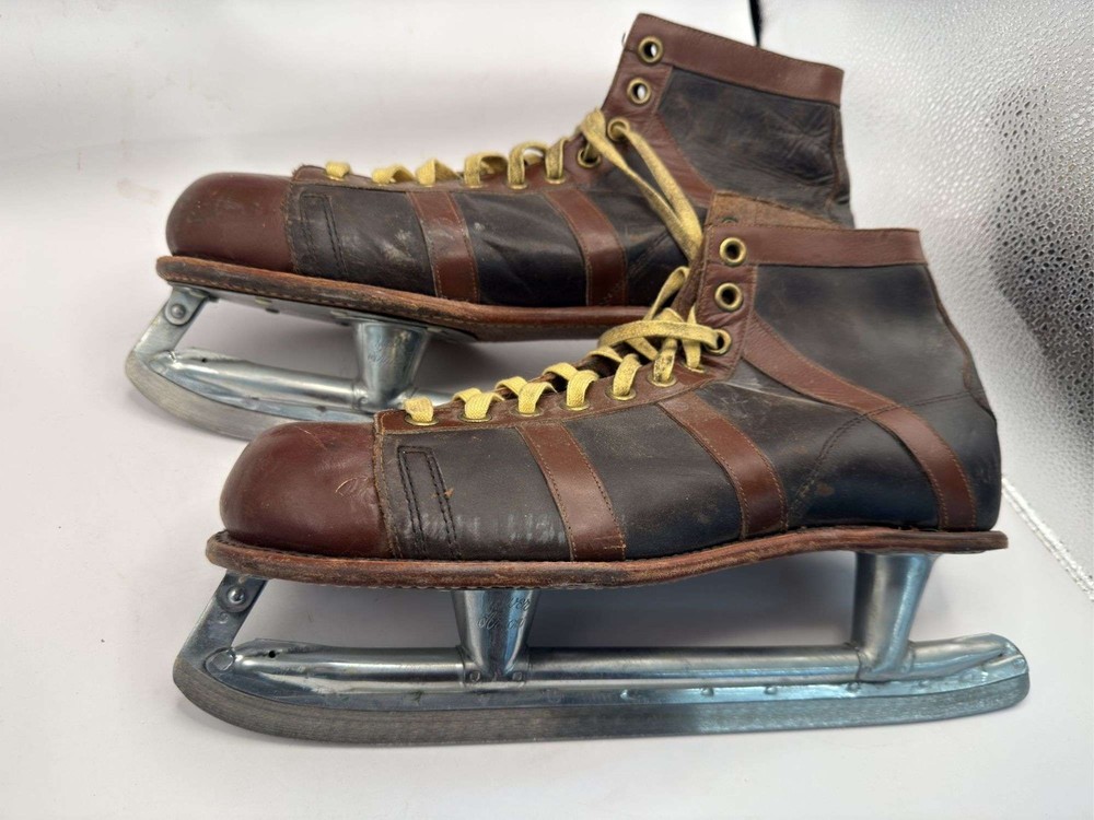 Antique silver arrow ice skates, size 11