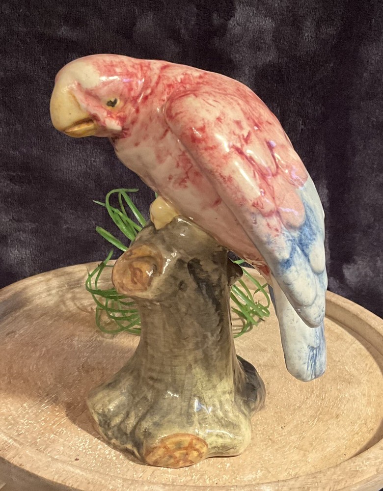 Vintage 6” pink & blue parrot on green tree stump