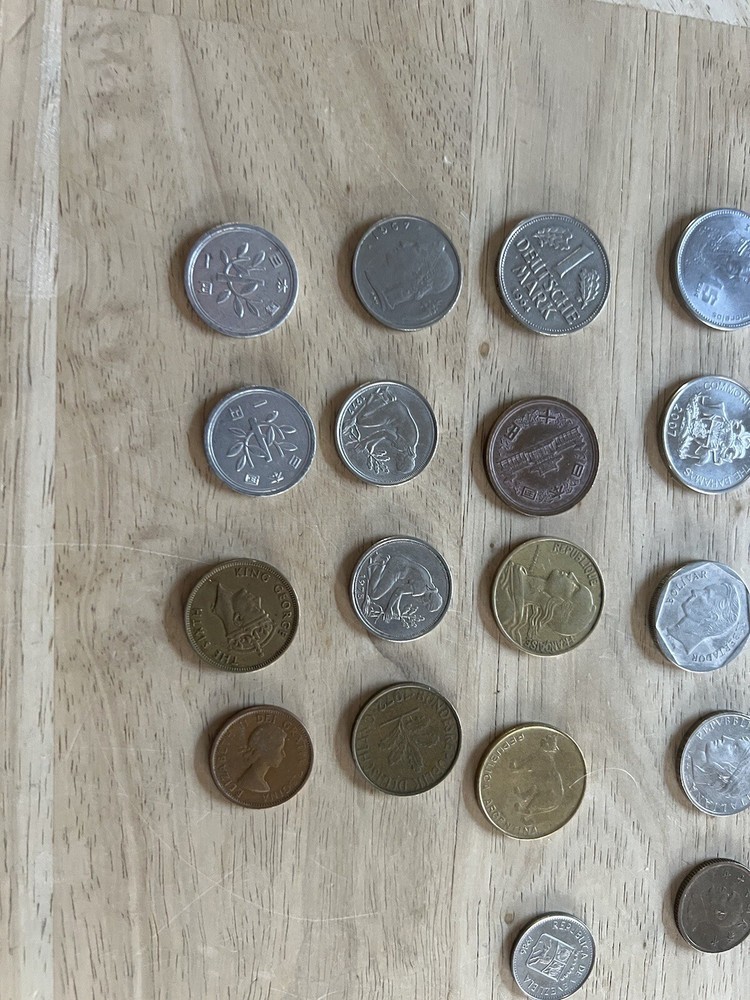 Assorted foreign coins. 26 Coins In Total