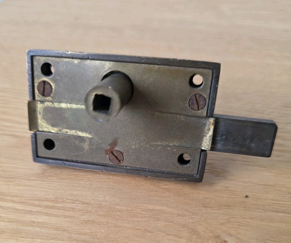 Antique brass vacant-engaged WC bathroom lock.