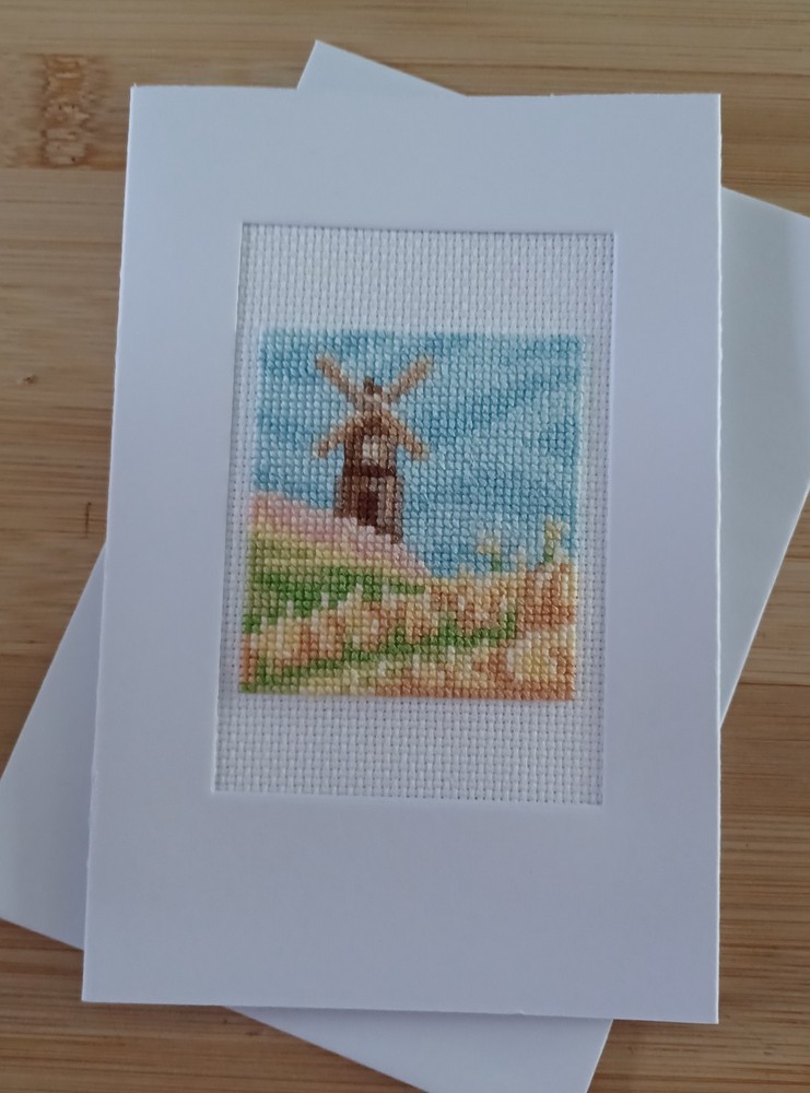 Spring windmill flowers. Finished X-stitch. White card, blank insert & envelope.