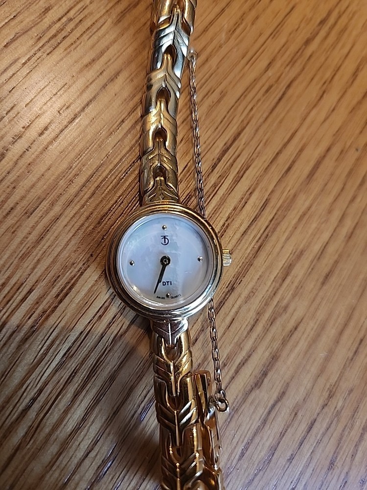 DTI Swiss Quartz Watch. Needs Battery