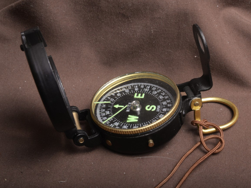 two lensatic compasses one with box