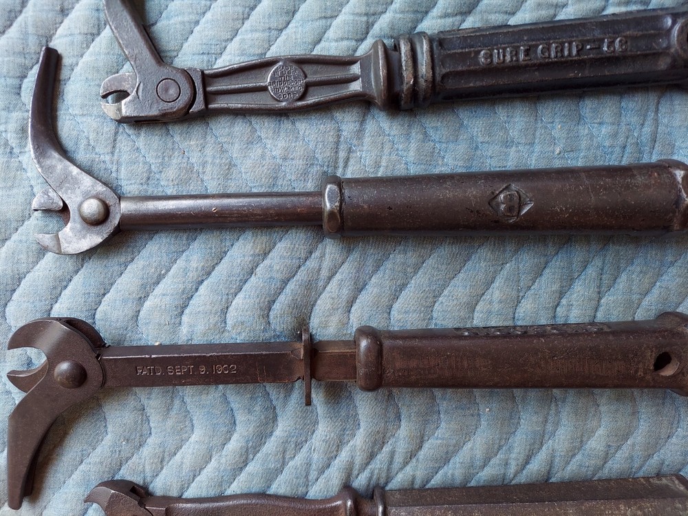 Collection of 8 different antique nail pullers