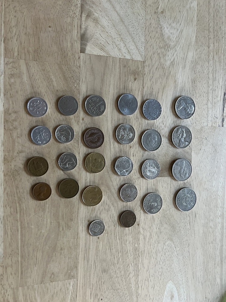Assorted foreign coins. 26 Coins In Total