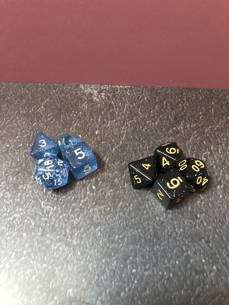 Two 4 Piece Multi Color Dice Sets