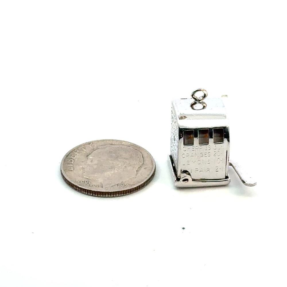 Vintage sterling slot machine charm -- spins
