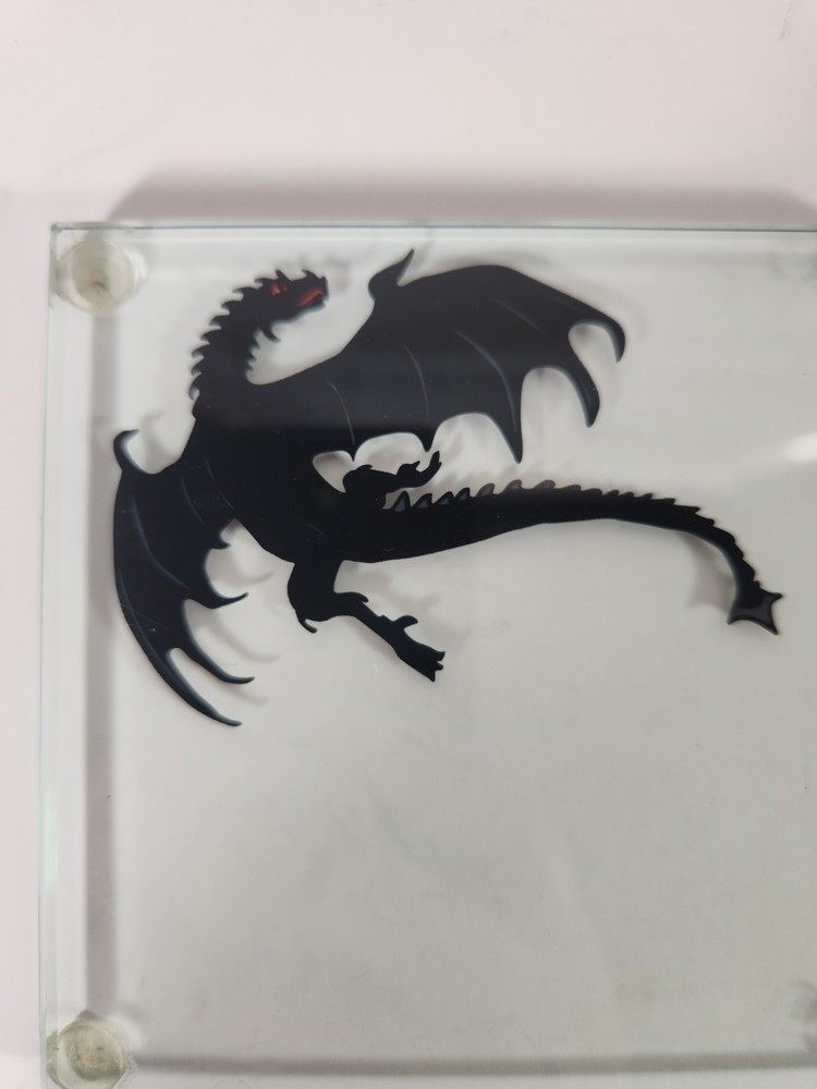 Glass Coasters With Dragon Silhouettes