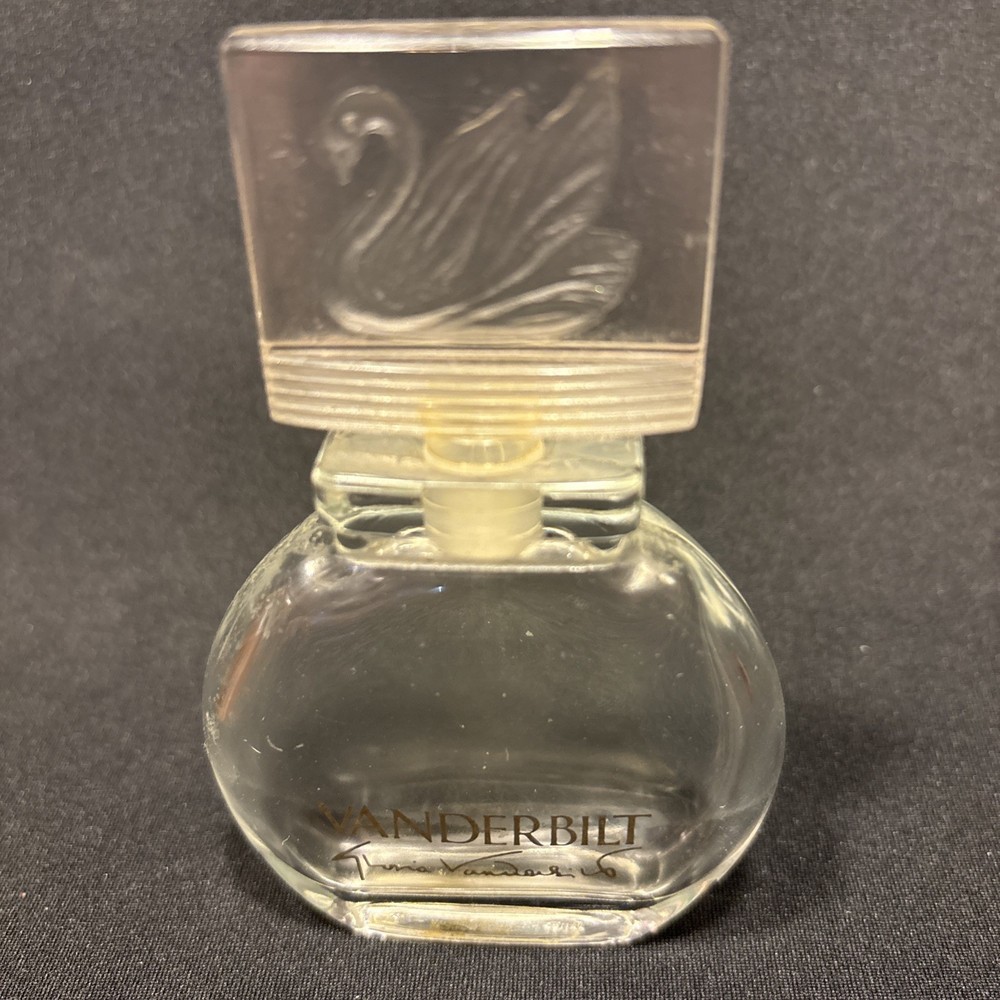 Gloria Vanderbilt perfume bottle, recognized by its distinct swan stopper.