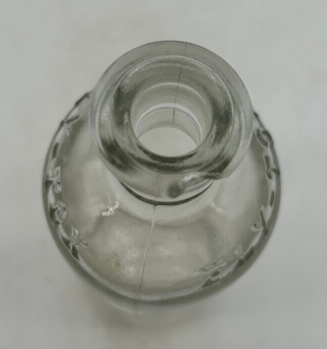 Clear small Fly Tox bottle with cork