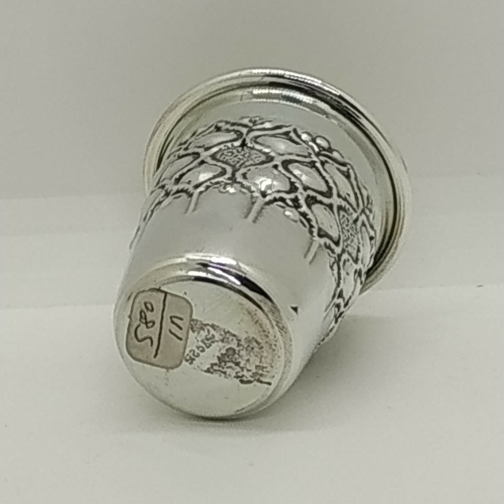 Handmade sterling silver liquor cup with embossed design